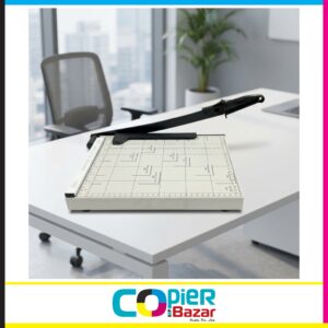 A4 paper cutter machine with measurement scale on office desk for precise paper cutting