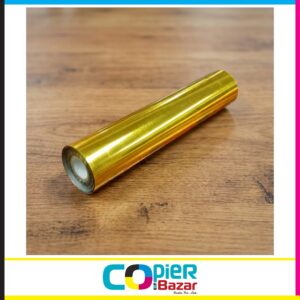 Gold foil lamination roll 12.5 inch showing glossy metallic finish on wooden surface